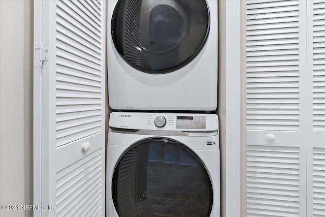 laundry room featuring stacked washer / dryer