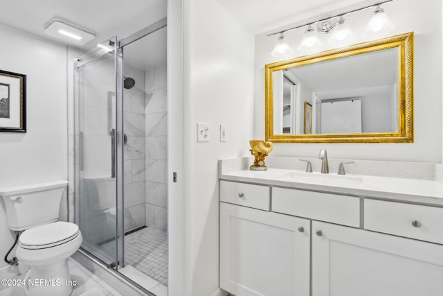 bathroom featuring toilet, vanity, and walk in shower