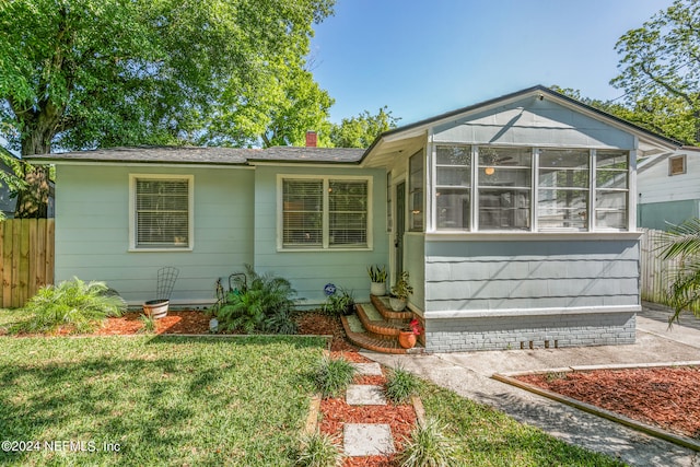 exterior space featuring a front lawn