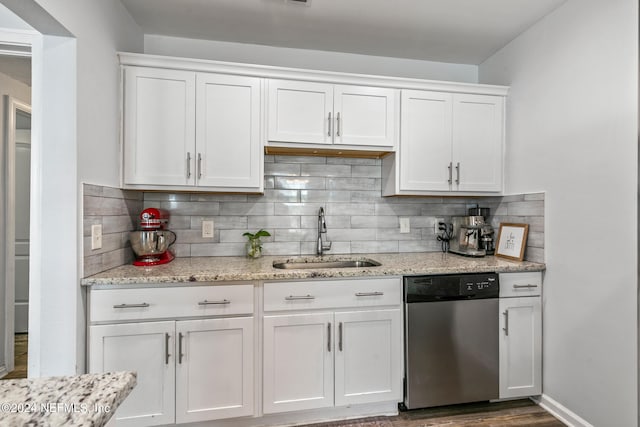 kitchen featuring dark wood-type flooring, sink, white cabinets, and stainless steel dishwasher