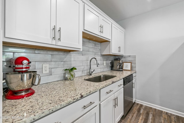 kitchen featuring white cabinets, dishwasher, sink, and dark wood-type flooring