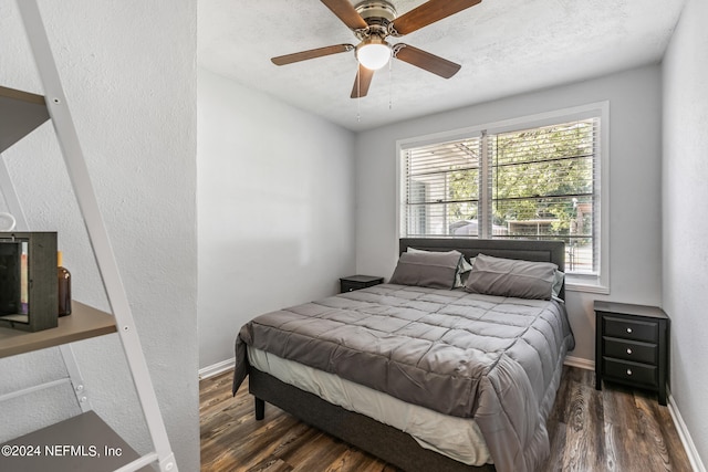 bedroom featuring dark hardwood / wood-style floors and ceiling fan