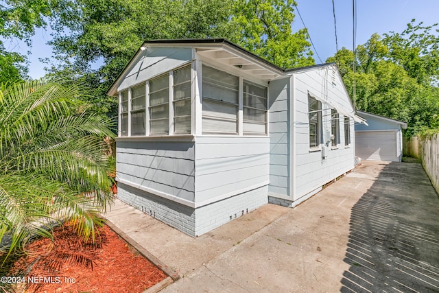 view of outbuilding featuring a garage