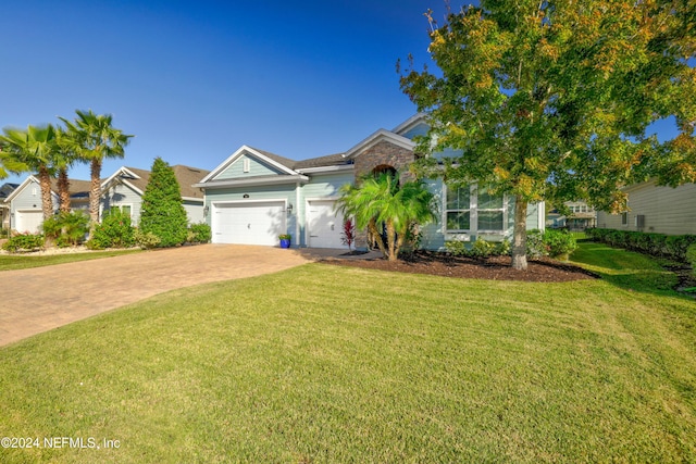 view of front facade with a front lawn and a garage