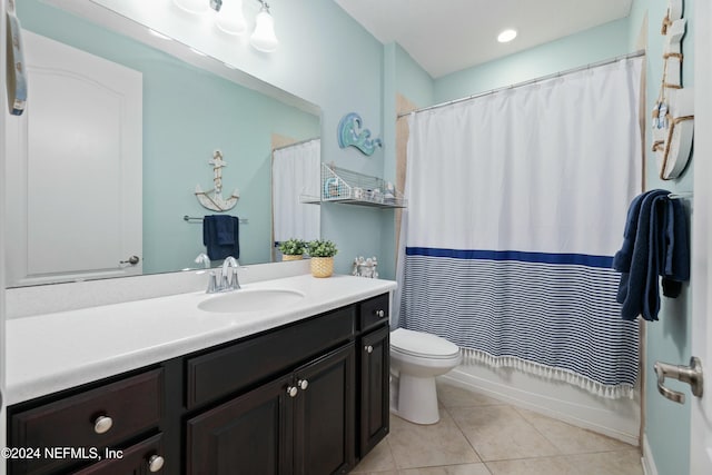 full bathroom with tile patterned flooring, vanity, shower / bath combo, and toilet