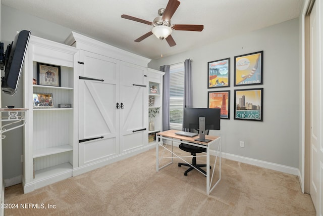 office area with ceiling fan and light colored carpet