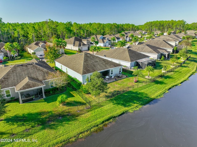 drone / aerial view with a water view