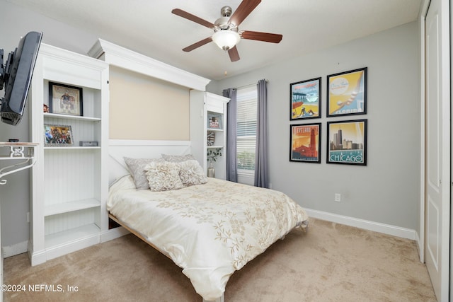 bedroom with a closet, light colored carpet, and ceiling fan