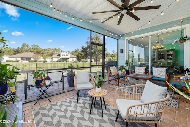 sunroom with wooden ceiling and ceiling fan with notable chandelier