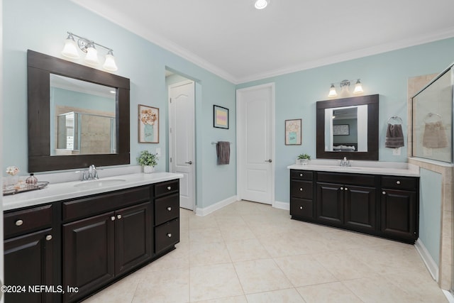 bathroom featuring vanity, tile patterned floors, a shower with door, and crown molding