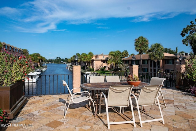 view of patio with a water view