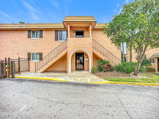 5375 Ortega Farms Blvd Unit 614, Jacksonville, FL 32210 - view of building exterior featuring stairway