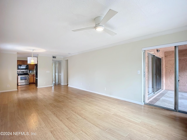 unfurnished living room featuring ceiling fan, light hardwood / wood-style floors, and ornamental molding