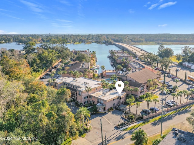 birds eye view of property with a water view