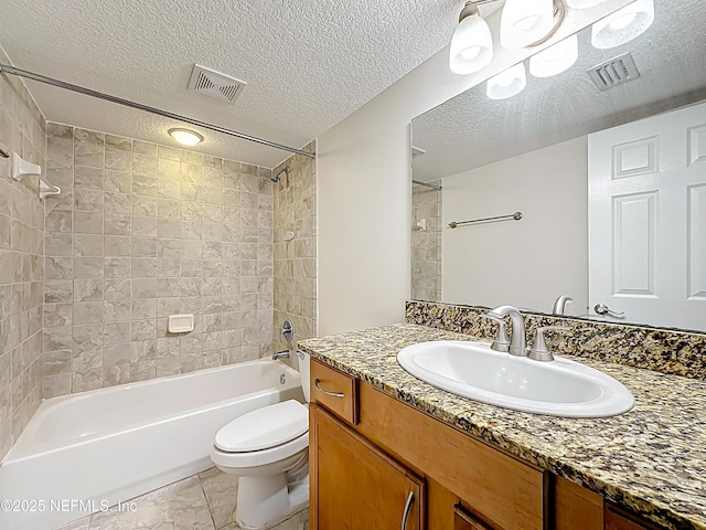 5375 Ortega Farms Blvd Unit 614, Jacksonville, FL 32210 - full bathroom featuring toilet, vanity, shower / bath combination, and a textured ceiling