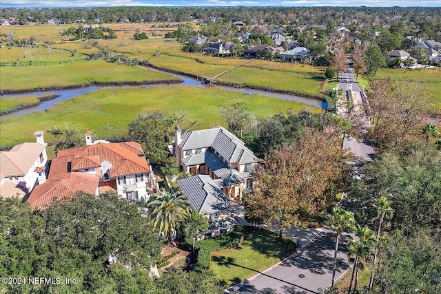 bird's eye view featuring a water view and a residential view