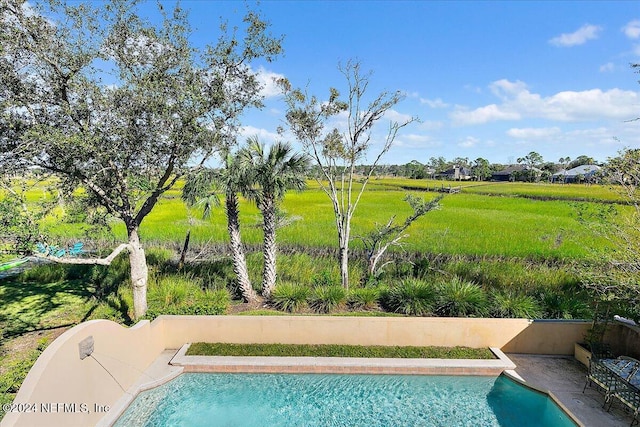 outdoor pool with a patio area