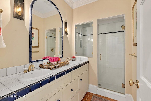 full bath featuring a shower stall, ornamental molding, double vanity, and a sink