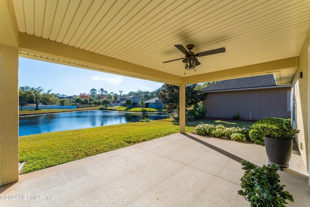 view of patio featuring ceiling fan and a water view