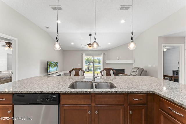 kitchen featuring a textured ceiling, vaulted ceiling, stainless steel dishwasher, and sink