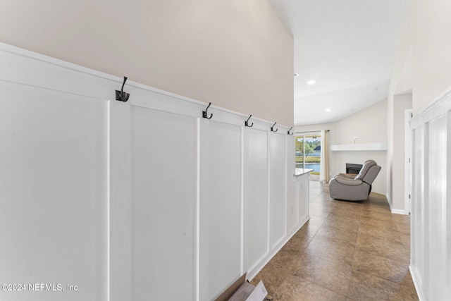 hallway featuring lofted ceiling