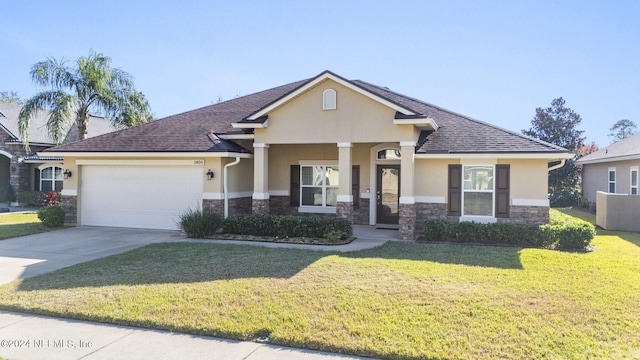 view of front of house with covered porch, a garage, and a front yard