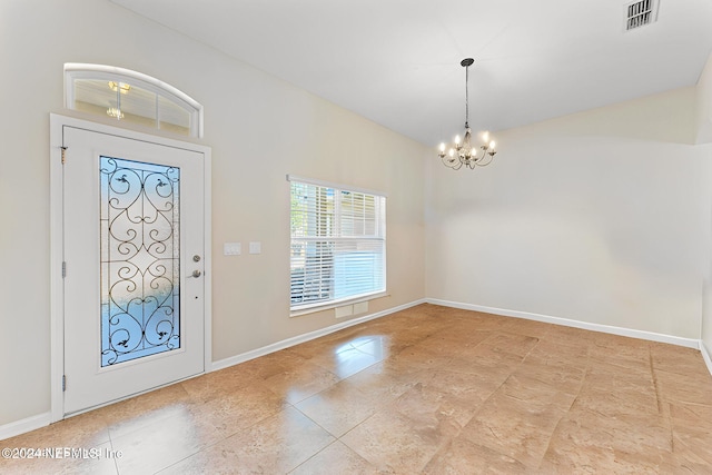 foyer with a notable chandelier