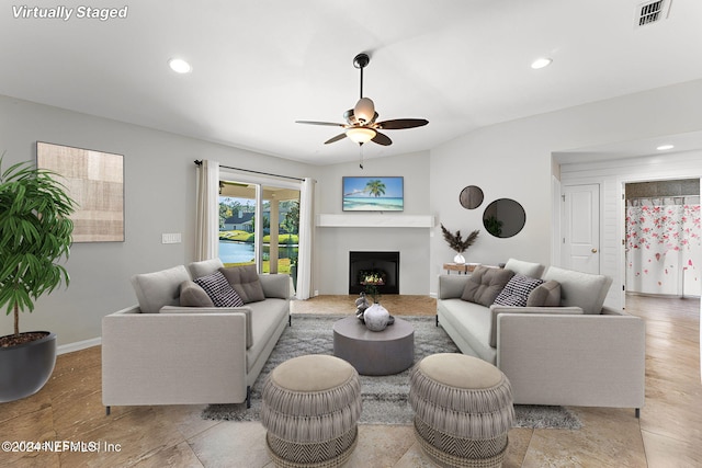 living room with vaulted ceiling and ceiling fan