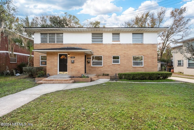 front facade with a front lawn