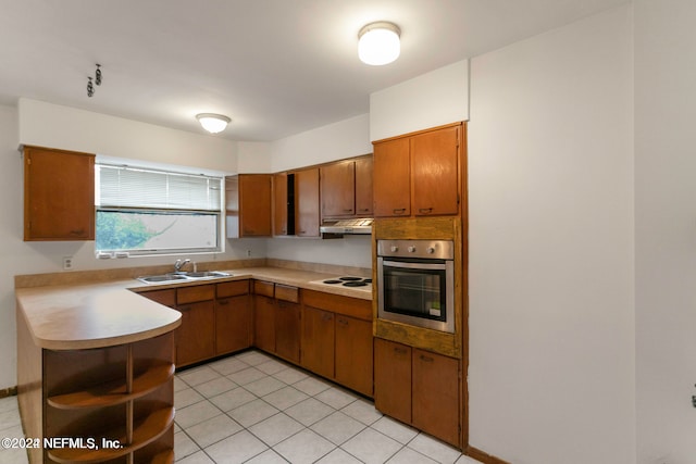 kitchen featuring stainless steel oven, sink, kitchen peninsula, white electric cooktop, and light tile patterned floors