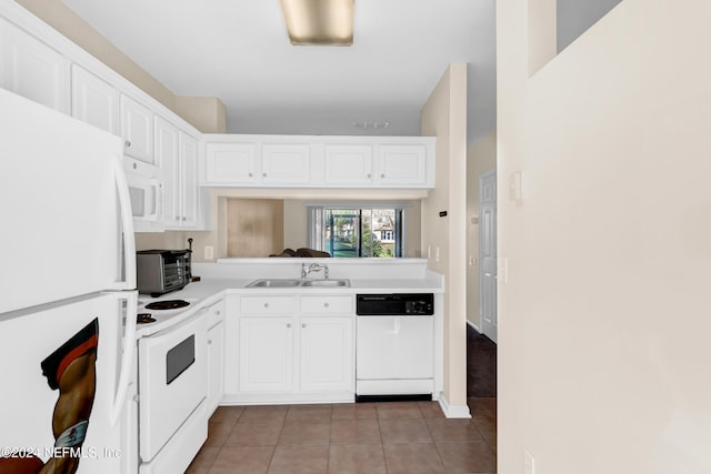 kitchen featuring white cabinets, light tile patterned flooring, white appliances, and sink