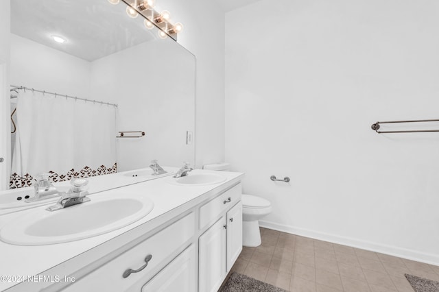 bathroom featuring tile patterned floors, vanity, toilet, and a shower with curtain