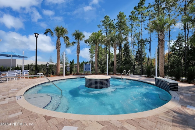 view of swimming pool featuring a patio