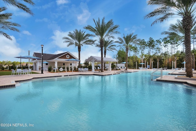 view of swimming pool featuring a patio area