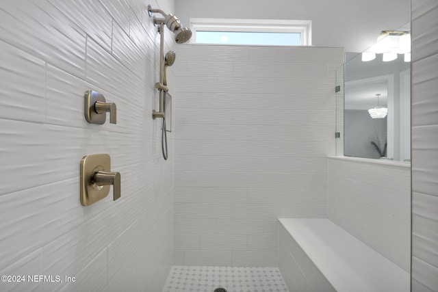 bathroom with a tile shower