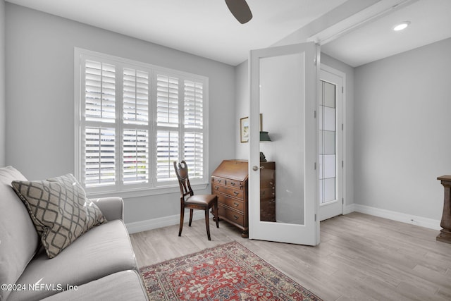 office area featuring french doors, light wood-type flooring, and ceiling fan