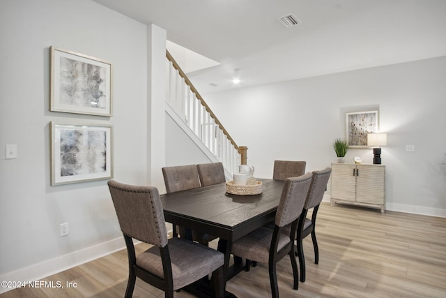 dining space featuring light hardwood / wood-style flooring