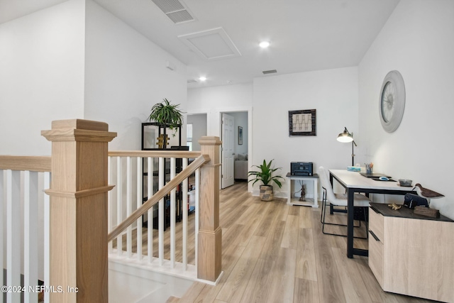 hallway with light hardwood / wood-style flooring