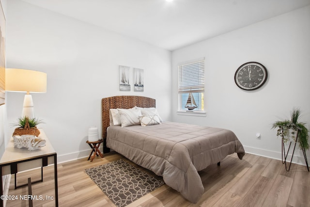 bedroom with light hardwood / wood-style flooring