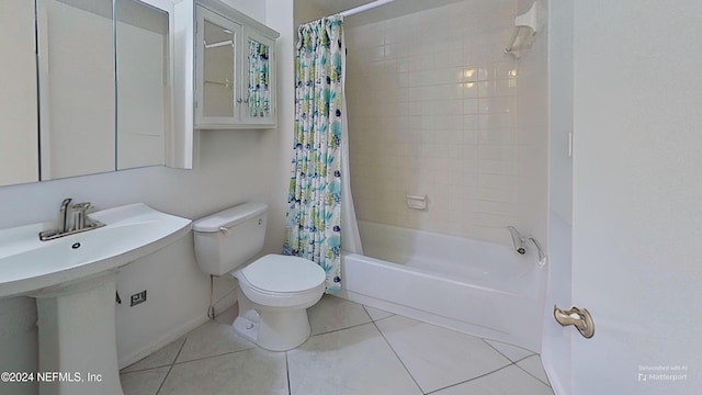 full bathroom with sink, tile patterned flooring, shower / bathtub combination with curtain, and toilet