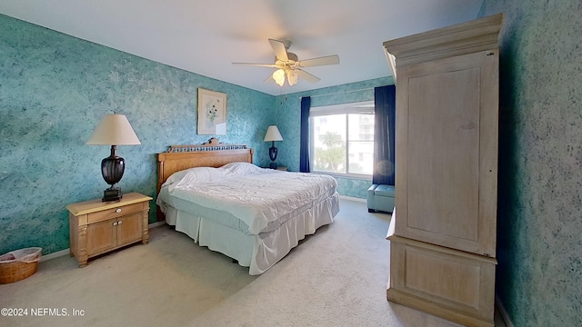 bedroom featuring ceiling fan and light colored carpet