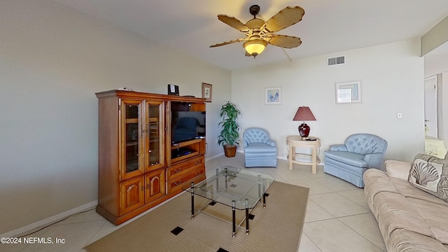 living room featuring ceiling fan and light tile patterned flooring