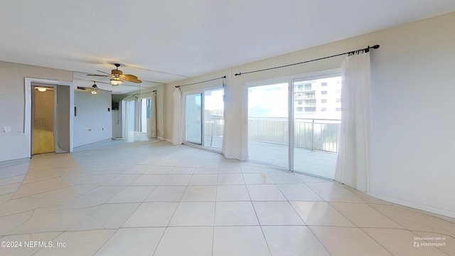 tiled empty room with ceiling fan