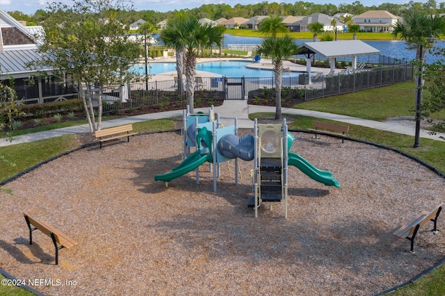 view of playground with a community pool