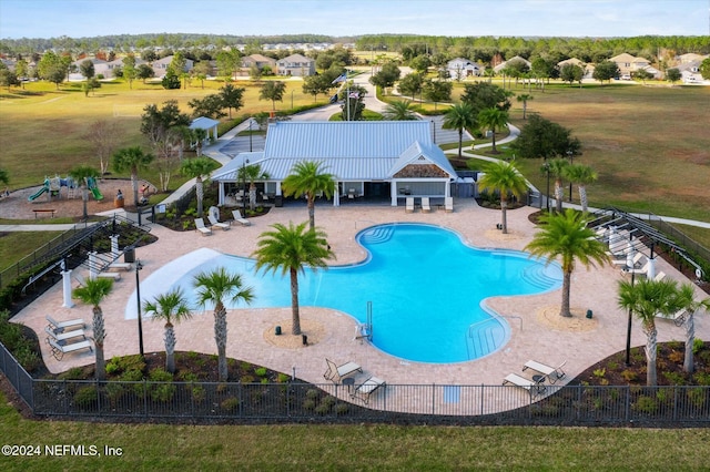 view of swimming pool with a patio