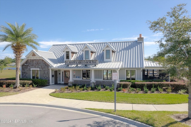 view of front of property with a front lawn