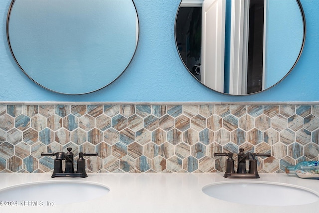 bathroom featuring decorative backsplash and vanity