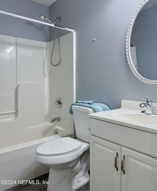 full bathroom with vanity, toilet, and shower / washtub combination