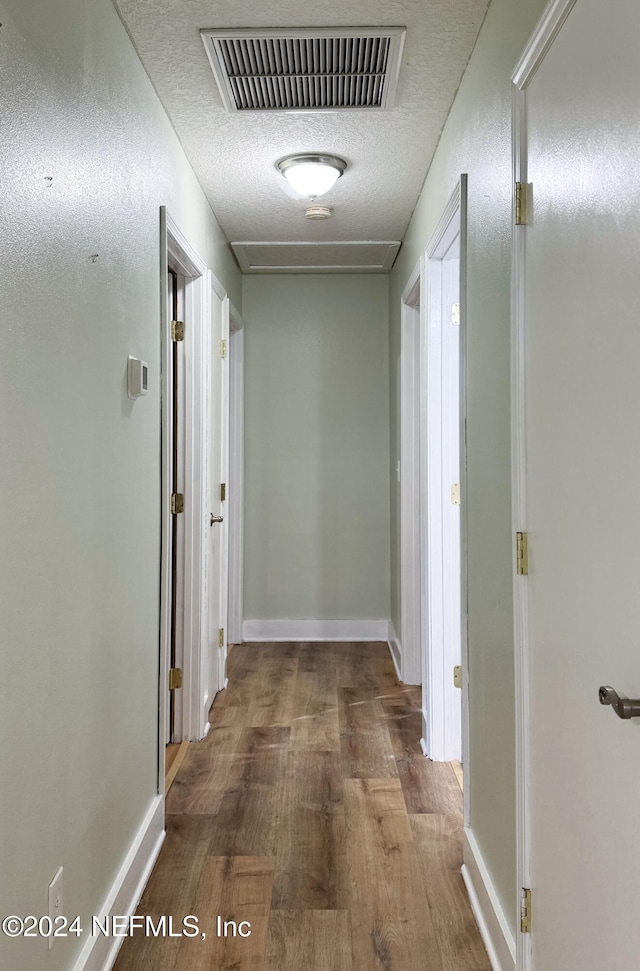 hall featuring wood-type flooring