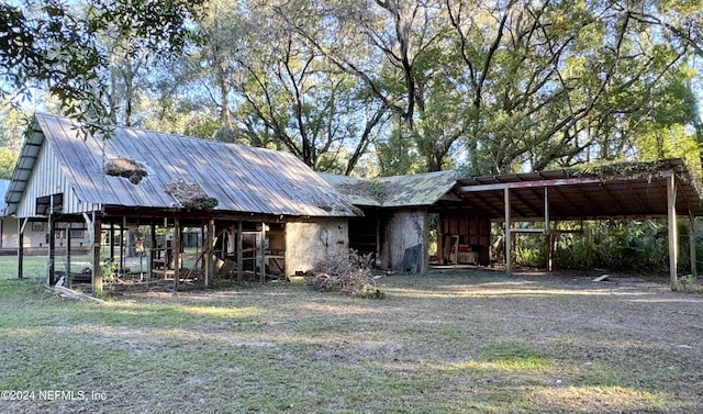 view of front of home featuring a carport